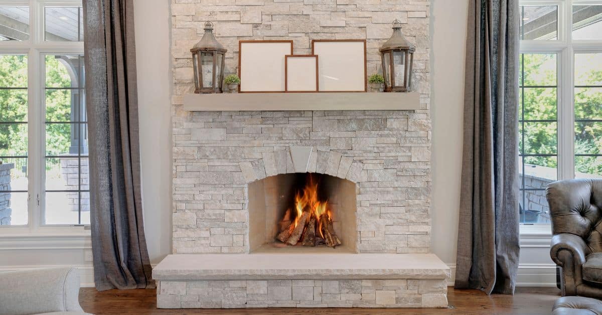 white natural stone veneer fireplace