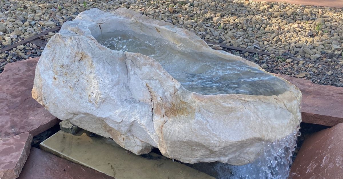 custom water feature made out of a boulder