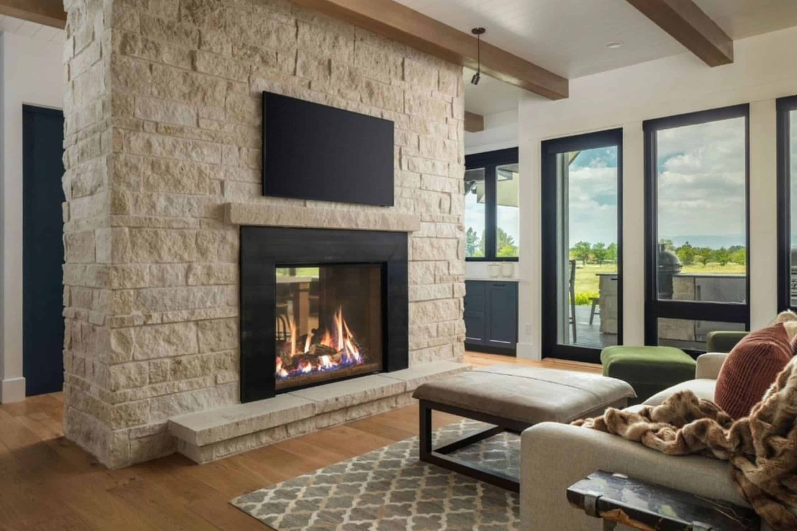 a fireplace made of natural stone in a modern home